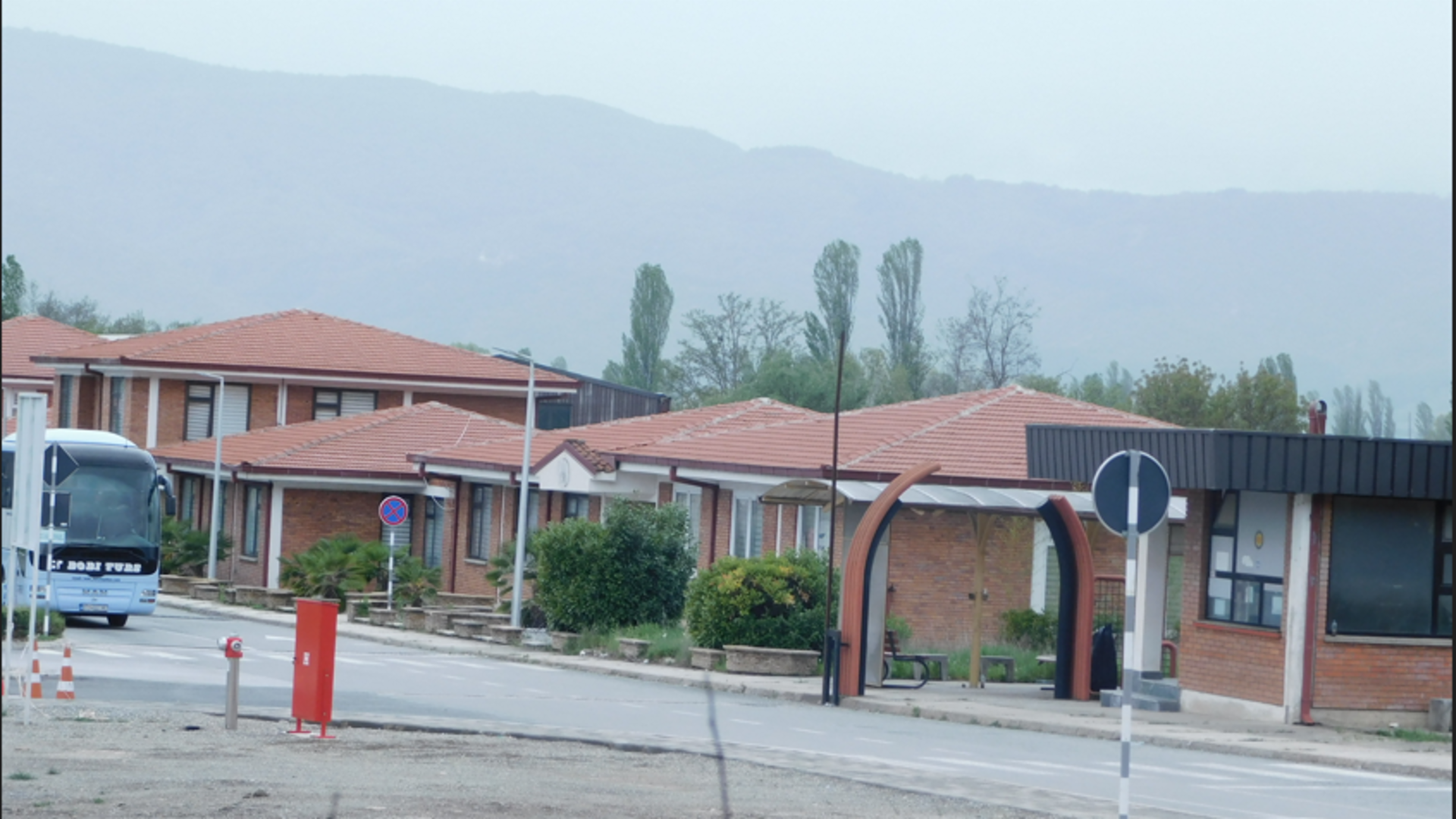 Neighborhood, Housing, City, Bus, Road, House, Roof, Suburb, Bench, Person