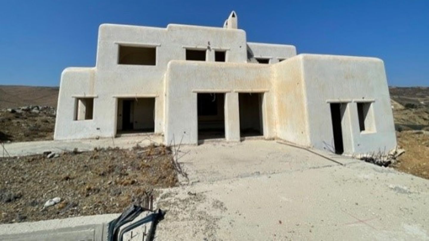 Photo of a complex with several unfinished villas on Mykonos that EOS is refurbishing to sustainable standards.